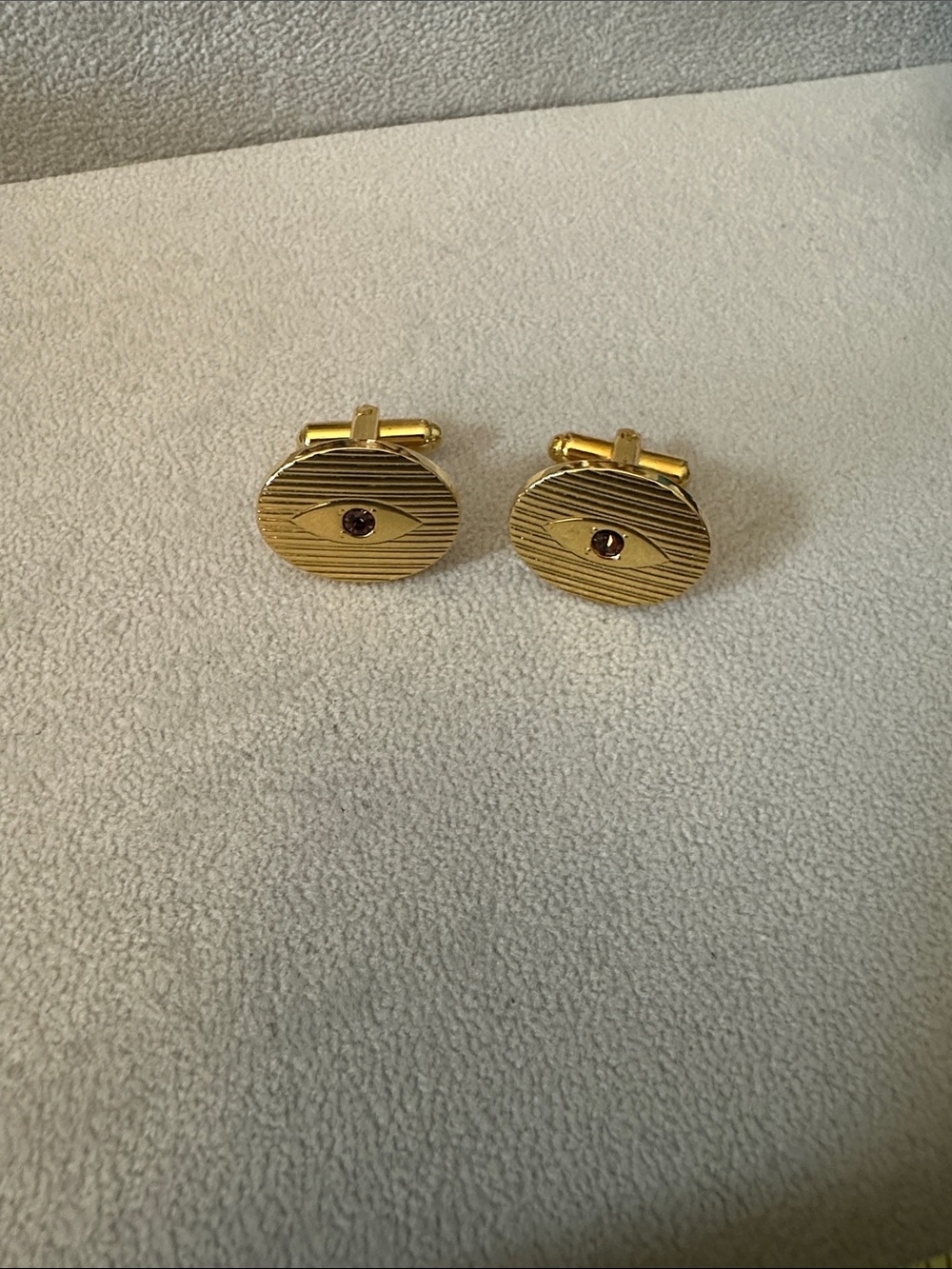 Gold Oval Cufflinks with Garnet Center